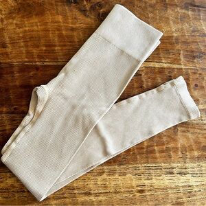 Beige ribbed leggings.